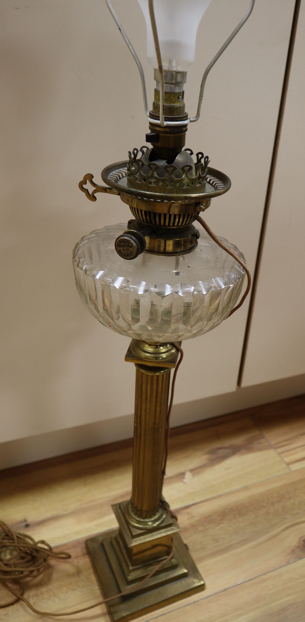 A Victorian brass stem oil lamp, height 58cm excl light fitting